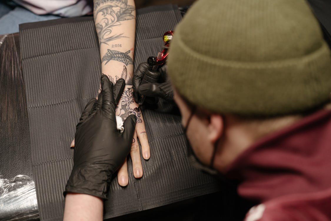 Tattoo dude doing tattoo things