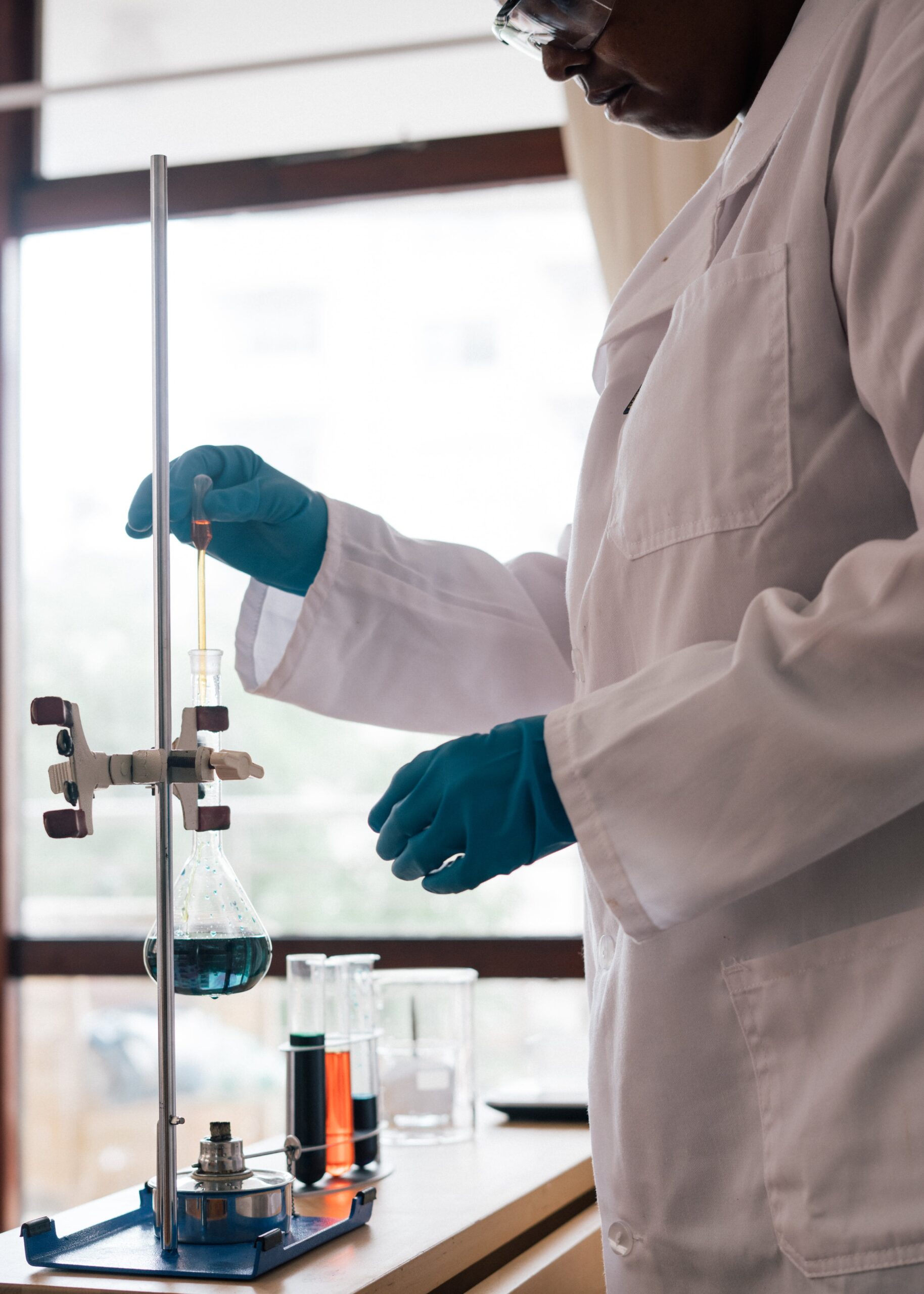 Pharmacist conducting research and performing a chemical test in a laboratory setting